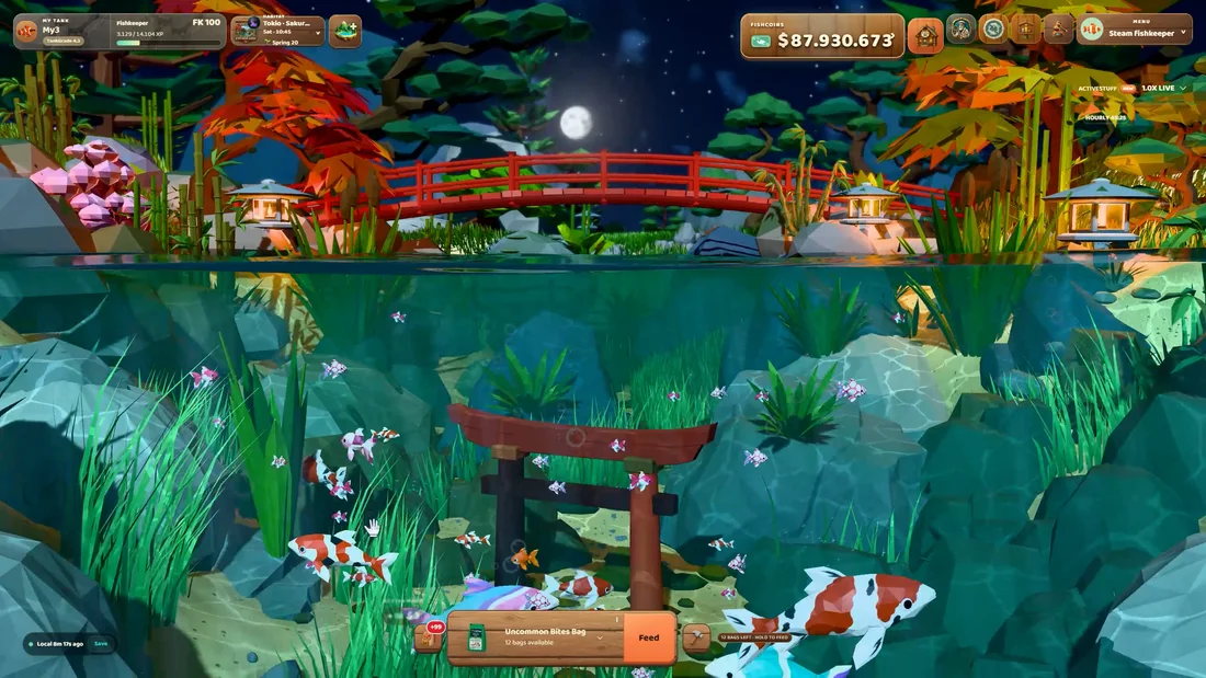 Fish swimming beneath a red bridge in the Japanese garden habitat at night